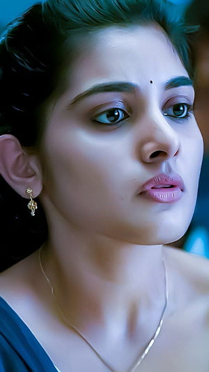 Nivetha Thomas Close-Up Portrait with Gold Earring and Necklace HD phone wallpaper