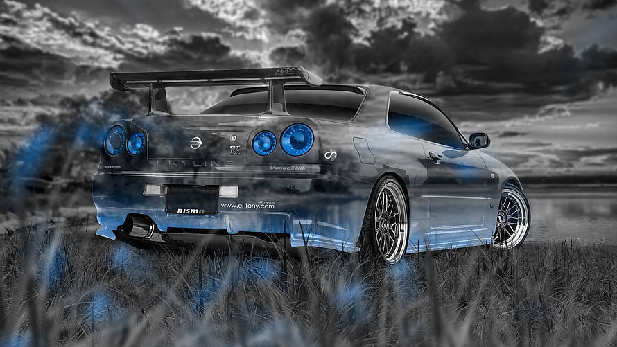 Nissan Skyline GT-R R34 with Blue Accents in Grassy Field HD wallpaper
