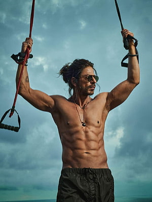 Shah Rukh Khan Shirtless Workout With Resistance Bands Against Cloudy Sky HD phone wallpaper