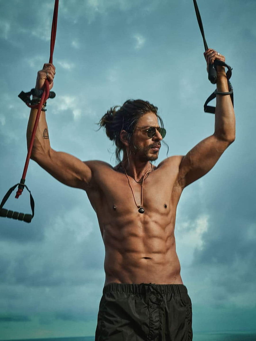 Shah Rukh Khan Shirtless Workout With Resistance Bands Against Cloudy Sky HD phone wallpaper