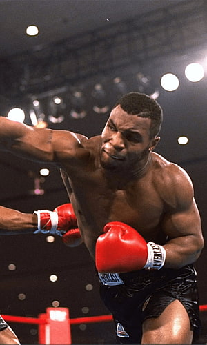 Mike Tyson Throwing a Punch in the Boxing Ring HD phone wallpaper