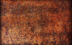 Weathered Rusty Metal Surface Texture with Deep Orange and Brown Corrosion Patterns HD wallpaper