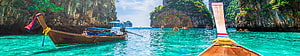 Traditional Thai Longtail Boats in Turquoise Waters Surrounded by Limestone Cliffs HD wallpaper
