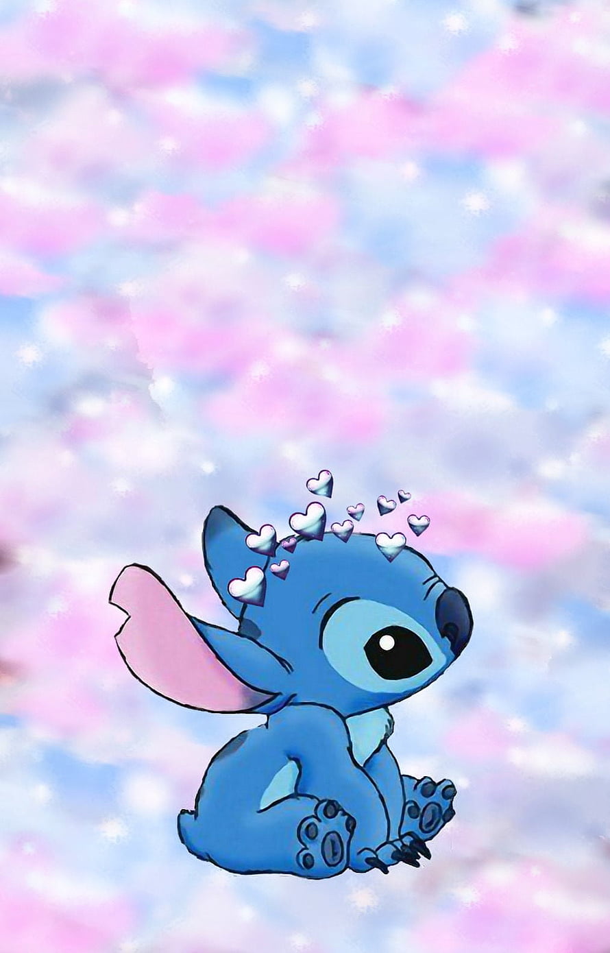 Cute Stitch Sitting With Floating Hearts Against A Pastel Pink And Blue Cloudy Sky Background HD phone wallpaper