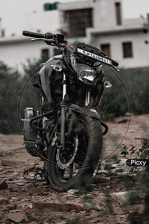 Black Apache RTR 160 4V Motorcycle Parked on a Gravel Path HD phone wallpaper