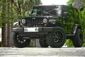 Black Modified Jeep Wrangler with Off-Road Tires and Custom Bumper HD wallpaper
