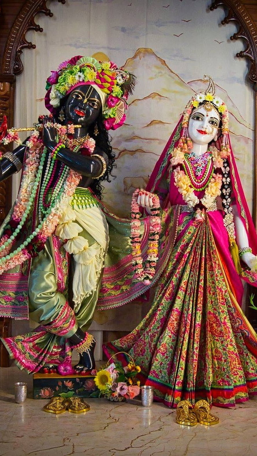Colorful Radha Krishna Deities in Traditional Silk Attire and Floral Garlands HD phone wallpaper