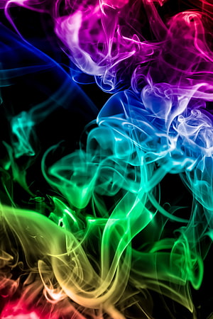 Vibrant Rainbow Smoke Swirling Against a Deep Black Background HD phone wallpaper