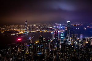 Hong Kong Skyline at Night with Victoria Harbour and Illuminated Skyscrapers HD wallpaper