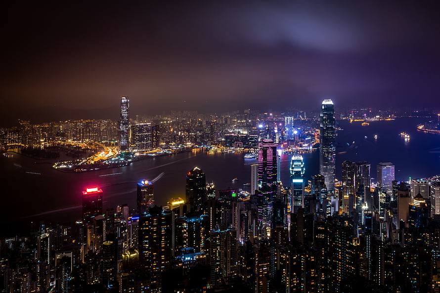 Hong Kong Skyline at Night with Victoria Harbour and Illuminated Skyscrapers HD wallpaper
