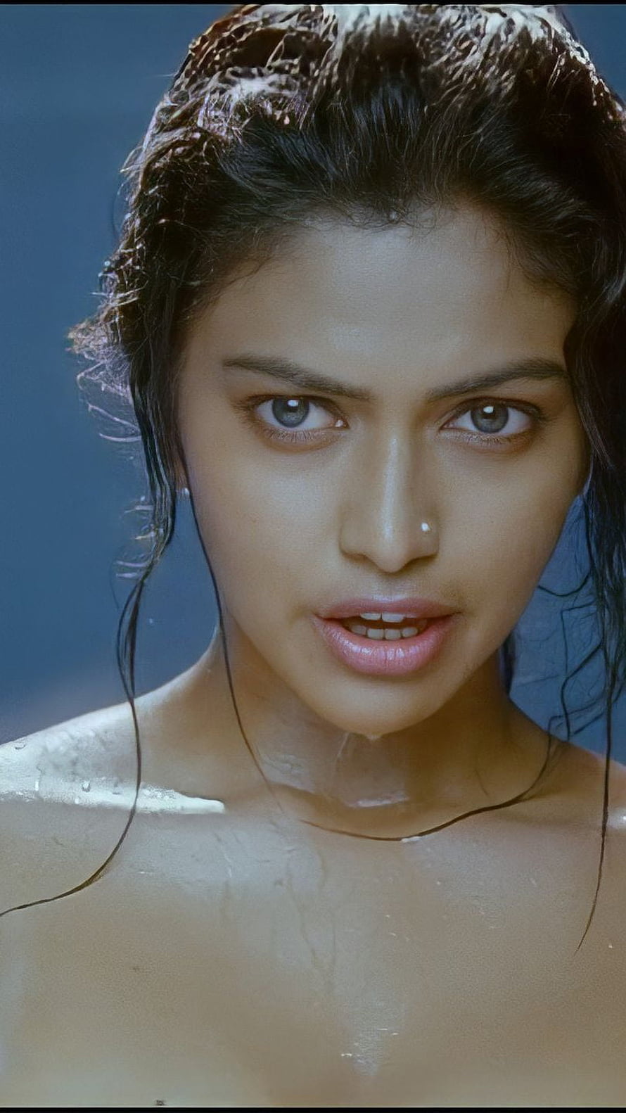 Amala Paul Close-Up Portrait with Wet Hair and Intense Gaze HD phone wallpaper