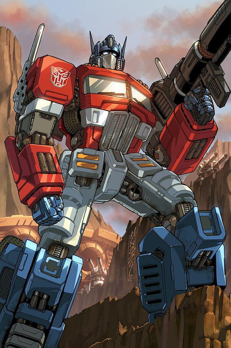 Optimus Prime G1 Comic Artwork Standing in Desert Canyon with Cannon HD phone wallpaper