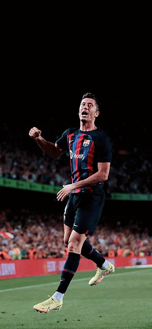 Robert Lewandowski Celebrating in Barcelona Home Kit on the Football Pitch HD phone wallpaper