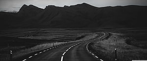 Monochrome Winding Road Through Vast Mountain Valley Landscape HD wallpaper