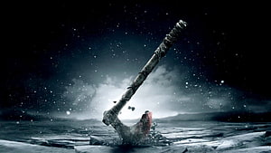 Viking Axe Embedded in Frozen Ice Under a Starry Night Sky HD wallpaper