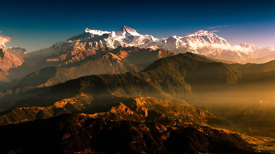 Majestic Himalayan Peaks in Nepal at Golden Hour with Snow-Capped Summits HD wallpaper