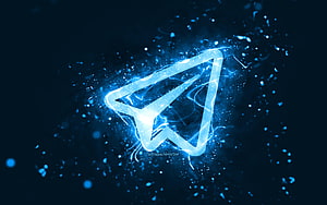 Glowing Telegram Paper Plane Logo with Electric Blue Neon Energy and Particle Effects HD wallpaper