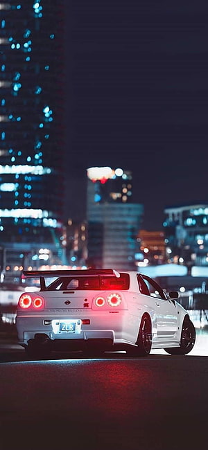 White Nissan Skyline GT-R R34 Night Cityscape Wallpaper HD phone wallpaper