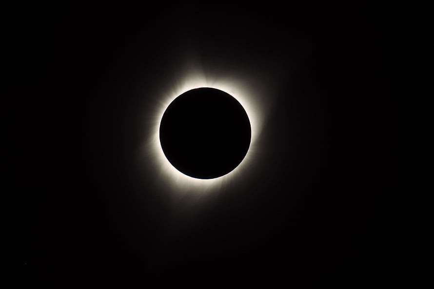 Total Solar Eclipse with Luminous Corona Against a Deep Black Sky HD wallpaper