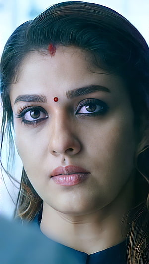 Portrait of Indian Actress Bhumi Pednekar with Traditional Bindis and Intense Gaze HD phone wallpaper