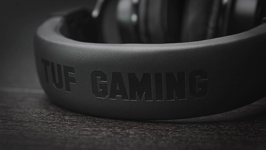 Asus TUF Gaming H3 Headset Close-Up on Dark Wood Surface HD wallpaper
