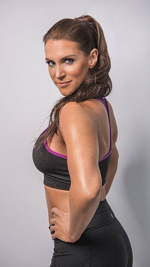 Stephanie McMahon in Black and Purple Athletic Sportswear HD phone wallpaper