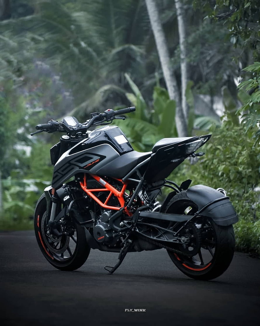 KTM Duke 390 Motorcycle in Matte Black and Orange on a Tropical Road HD phone wallpaper