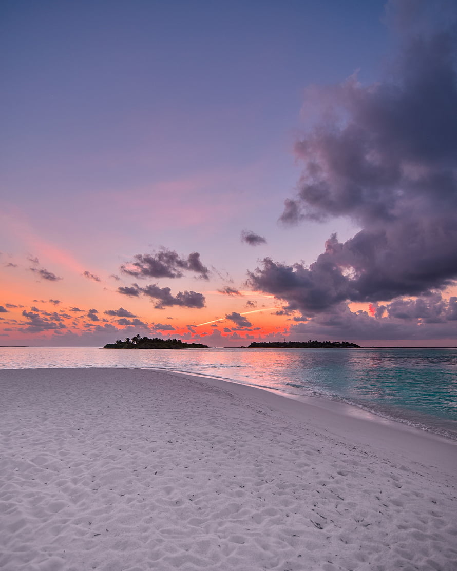 Serene Tropical Beach Sunset with White Sand and Turquoise Ocean HD phone wallpaper