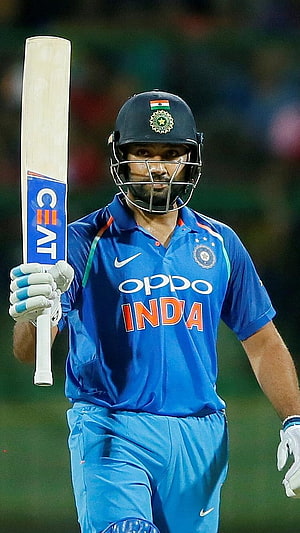 Virat Kohli in Indian Cricket Team Blue Jersey Holding Bat HD phone wallpaper
