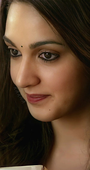 Kiara Advani Close-Up Portrait with Soft Warm Lighting and Natural Makeup HD phone wallpaper
