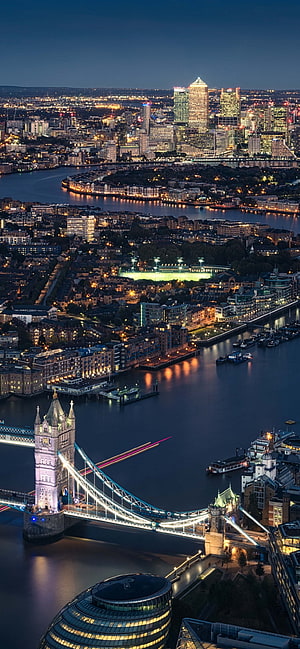 Aerial Night View of London Featuring Tower Bridge, City Hall, and Canary Wharf Skyline HD phone wallpaper