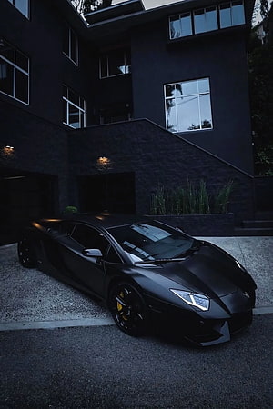 Matte Black Lamborghini Aventador Parked in Front of Modern Dark House HD phone wallpaper