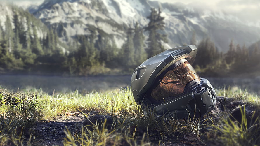 Halo Infinite Master Chief Helmet Resting in Mountain Grassland HD wallpaper