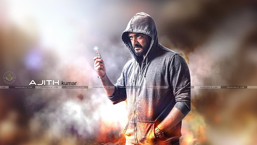 Ajith Kumar in a grey hoodie holding a lit cigarette against a smoky background HD wallpaper