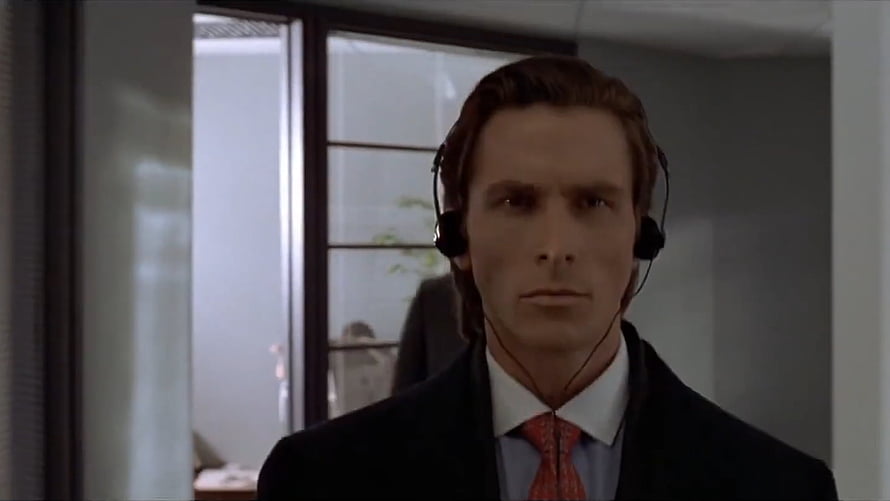 Patrick Bateman in a dark suit and red tie wearing a black headset in a modern office, Patrick Bateman in Heads HD wallpaper