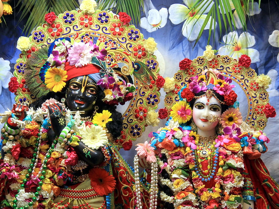 Colorful Radha Krishna Idols Adorned With Fresh Flowers And Jewels HD wallpaper