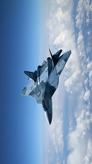 Sukhoi Su-57 Felon Stealth Fighter Jet Soaring High Above Clouds in Blue Sky HD phone wallpaper