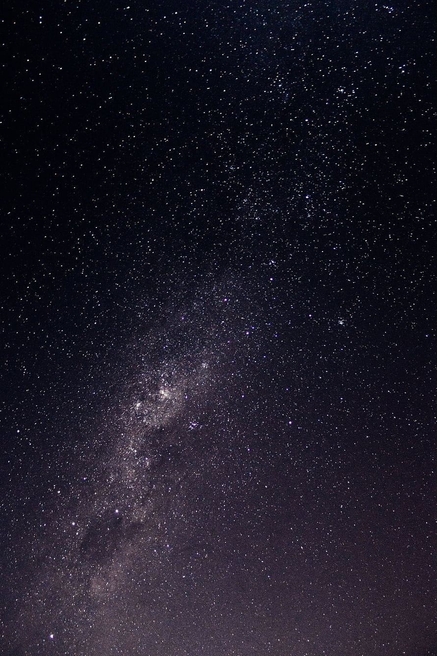 Milky Way Galaxy Arching Across a Deep Starry Night Sky with Dense Star Fields HD phone wallpaper