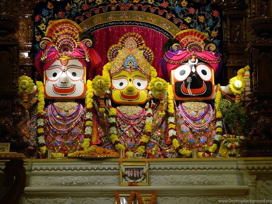 Lord Jagannath and Brothers in Ornate Temple Setting with Vibrant Garlands HD wallpaper