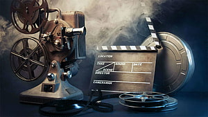 Vintage Film Projector and Clapperboard with Dramatic Smoke Effect HD wallpaper