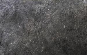 Scratched Dark Metal Surface Texture with Diagonal Brushed Steel Finish HD wallpaper