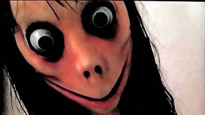 Scary Momo Creepy Face With Wide Eyes And Disturbing Smile HD wallpaper