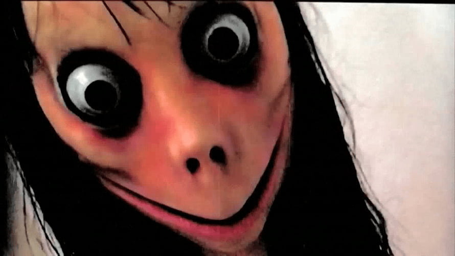 Scary Momo Creepy Face With Wide Eyes And Disturbing Smile HD wallpaper