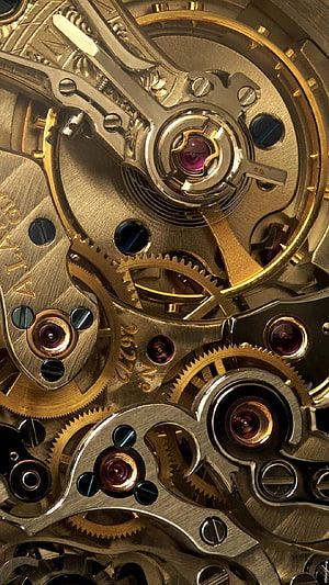 Intricate Mechanical Watch Movement with Brass Gears and Jeweled Bearings HD phone wallpaper