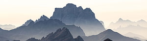 Misty Mountain Ranges at Dawn with Layered Peaks and Soft Morning Light HD wallpaper