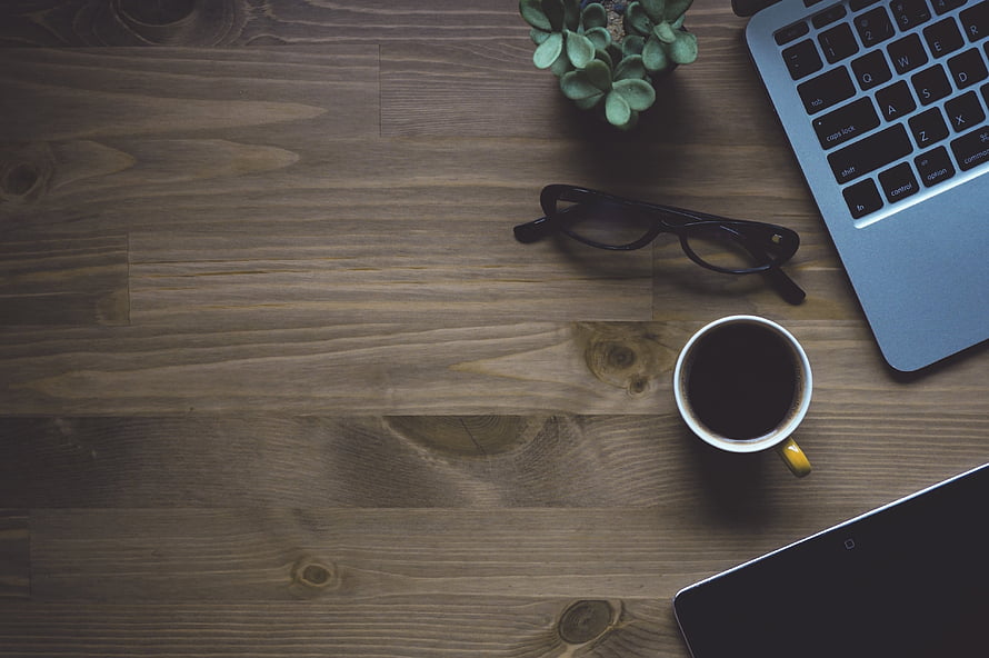 Cozy Workspace Flat Lay with Laptop, Coffee, Glasses, and Succulent on Wood HD wallpaper