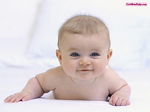Smiling Baby Boy Lying on White Blanket with Blue Eyes and Light Hair HD wallpaper
