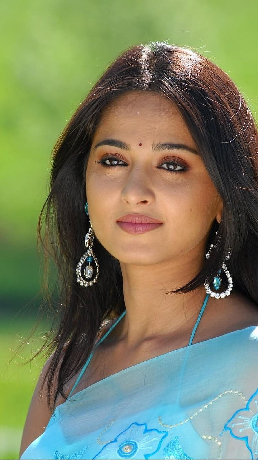 Anushka Shetty in a Light Blue Saree with Traditional Jewelry and a Soft Outdoor Portrait HD phone wallpaper
