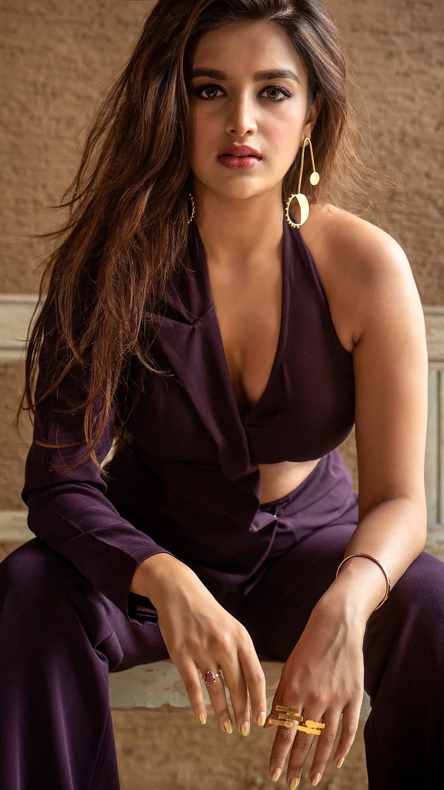 Niddhi Agarwal in a deep purple halter top and matching trousers with gold jewelry HD phone wallpaper