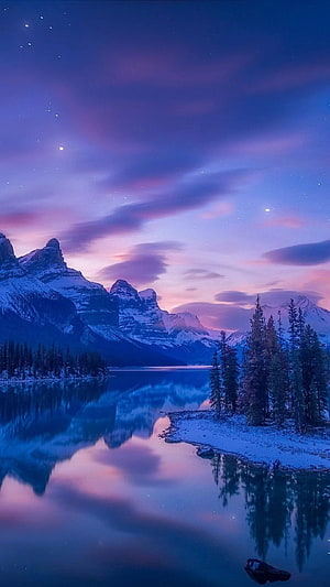 Serene Winter Lake Reflections of Snowy Mountains Under a Purple Twilight Sky HD phone wallpaper